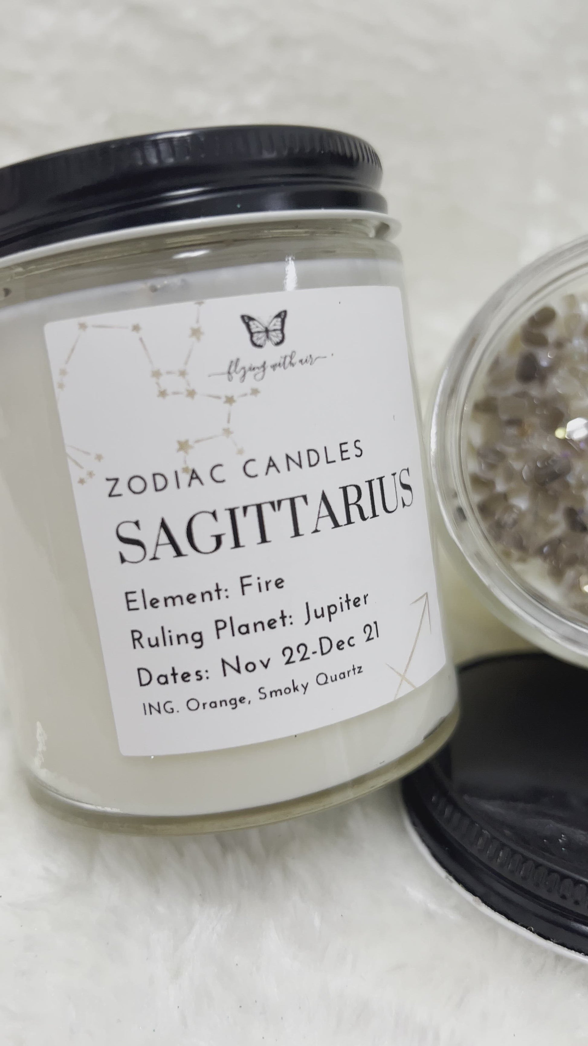 Sagittarius Zodiac Candle A delightful soy based, magical candle for your relaxation and fulfillment of confidence in accordance to your zodiac sign.  Product Properties  Volume: 6 oz glass jar  Burn Time: 10-15 hours  Primary Color: White  Scent: Orange Crystal Energy: Smoky Quartz Tumbled, Smoky Quartz Chips